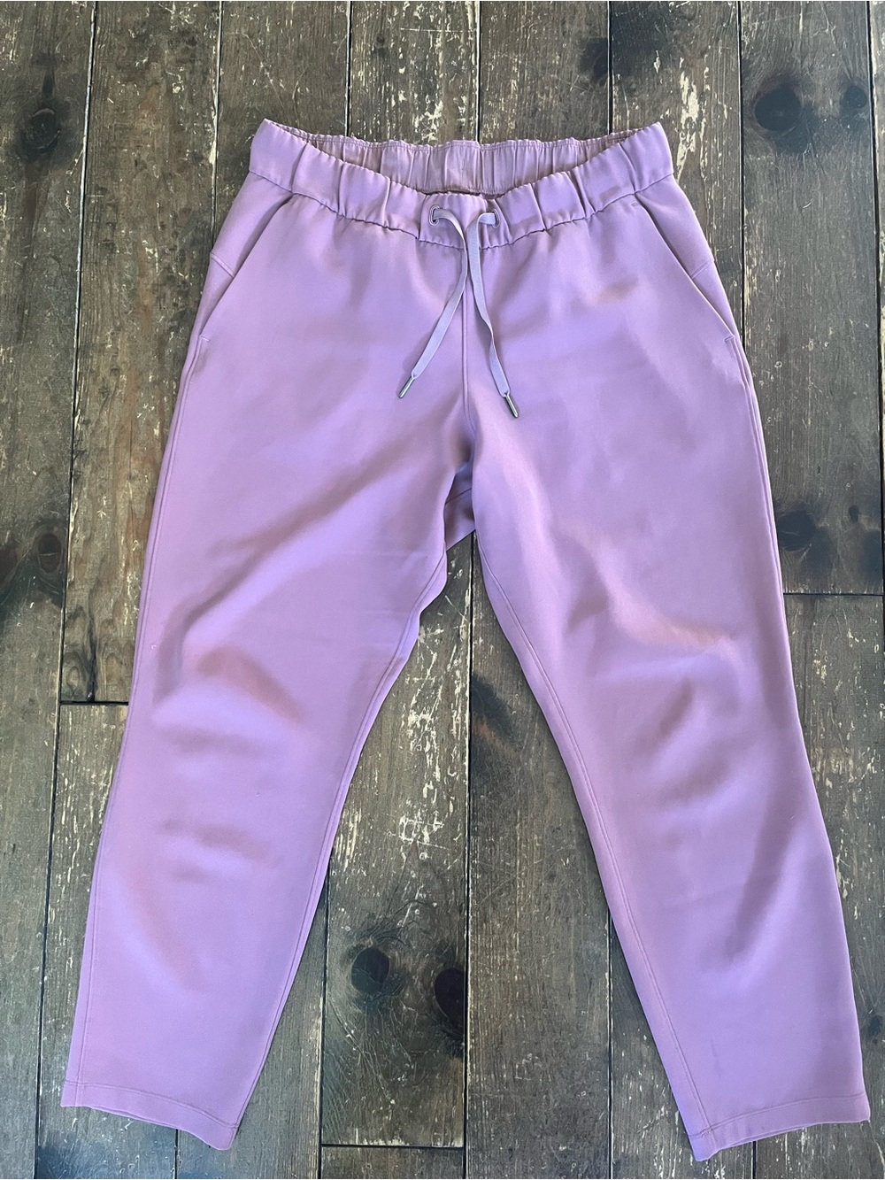 Lululemon Womens On the Fly pants in mauve pink, size 10.